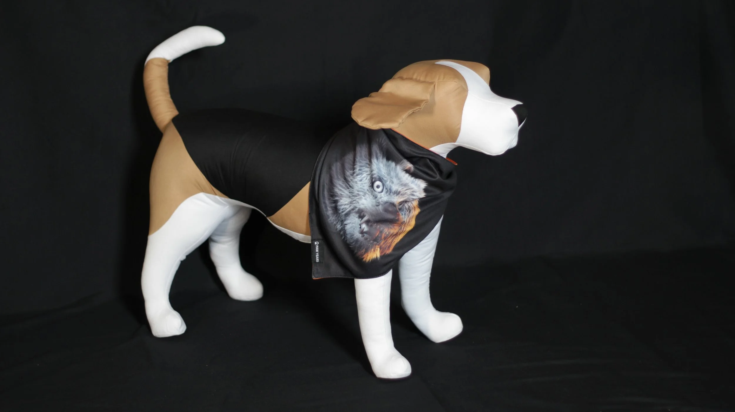 Side view of dog mannequin wearing black Lycan bandana featuring grey wolf art.