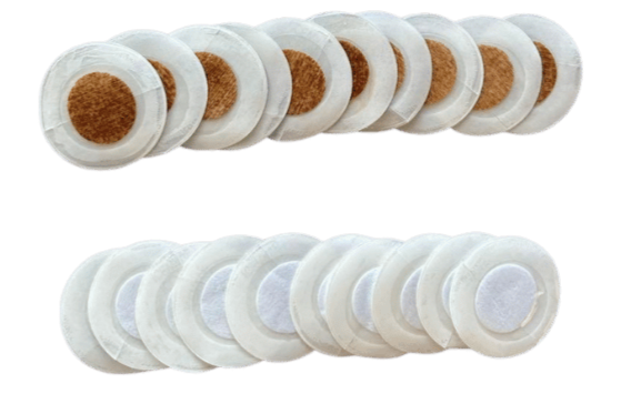 A line of cotton pads and a line of adhesive bandages.