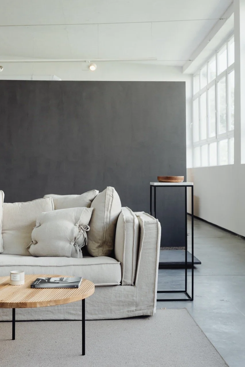 kaboompics_living-room-with-comfortable-linen-sofa-wooden-table-carpet-pillows-22042 Large.jpeg