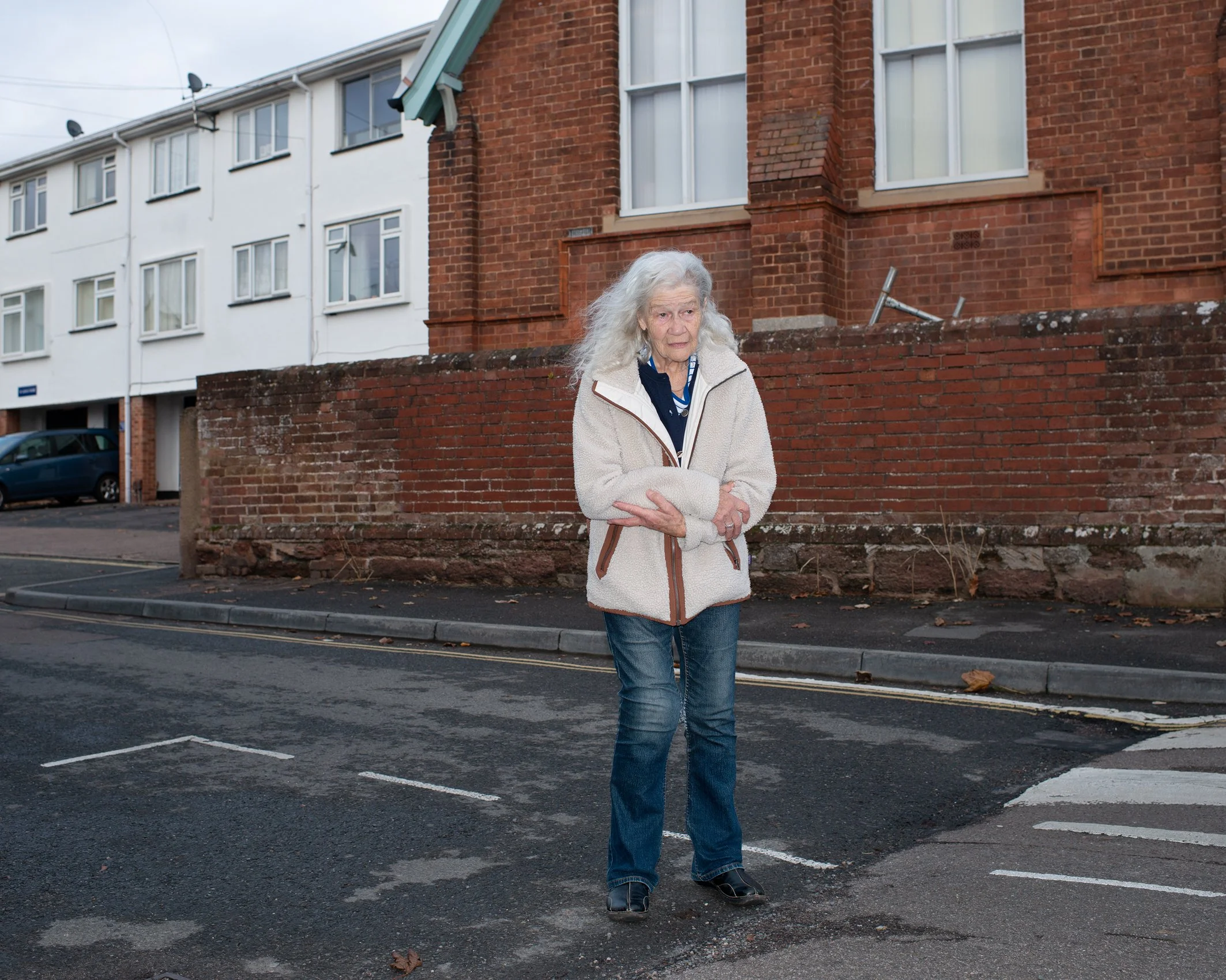 Elderly woman walking in street
