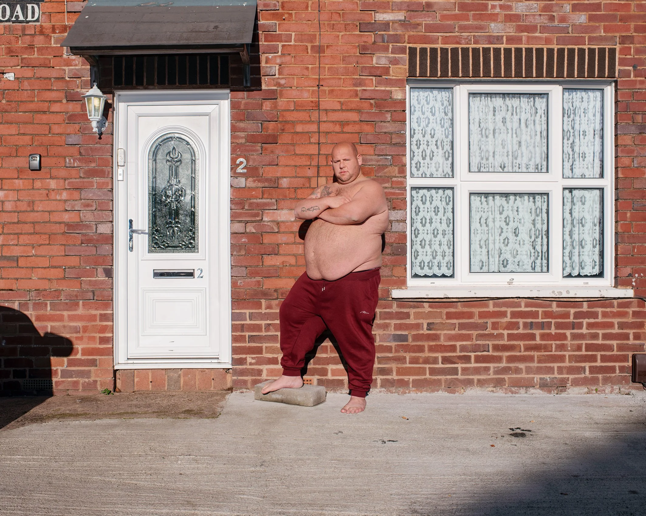 Billy outside his house