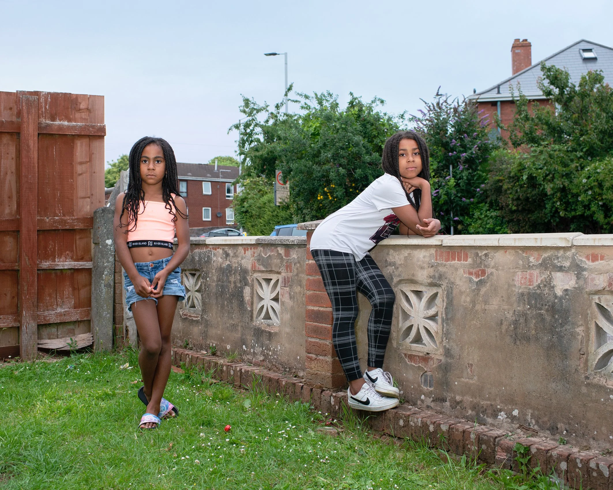 Sisters Ayisha and Amaya in their front garden