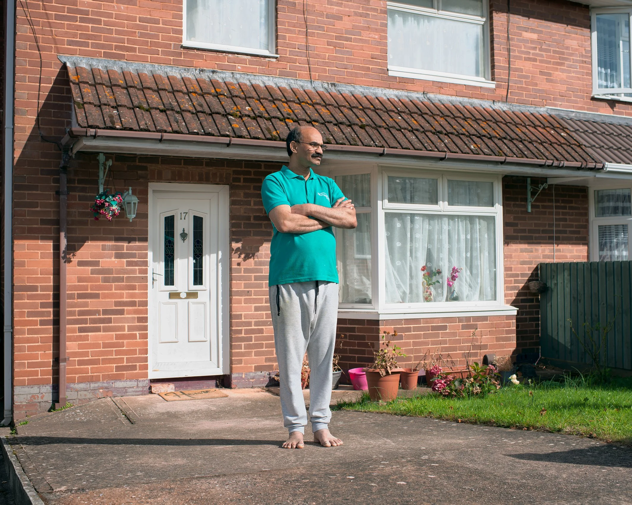 Man standing in his front garden