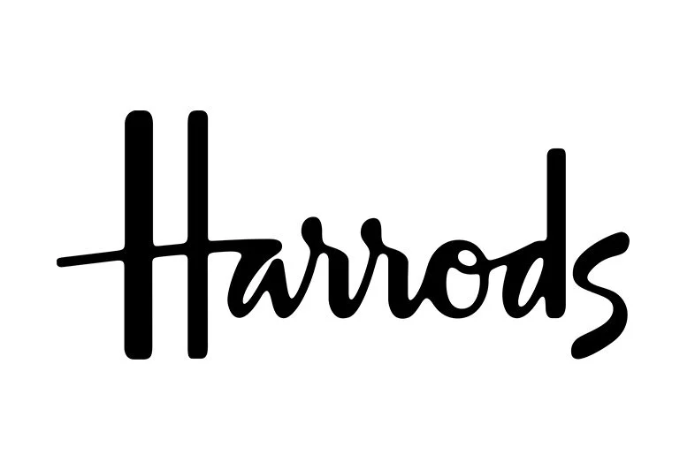 Harrods logo in black cursive script on a white background.