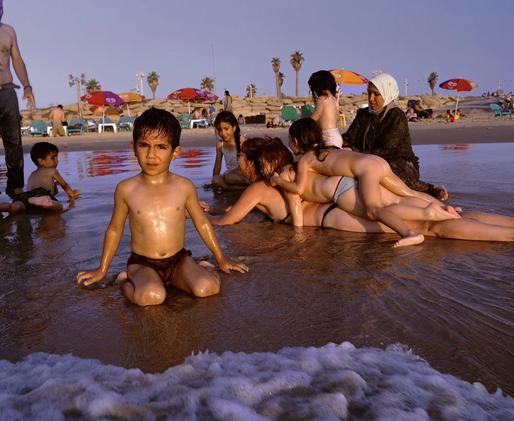 Gillian Laub Families on Jaffa Beach, Tel Aviv, Isreal, August, 2003 Chromogenic prints 20 x 24"    Edition of 8 30 x 40"    Edition of 5 40 x 50"    Edition of 3