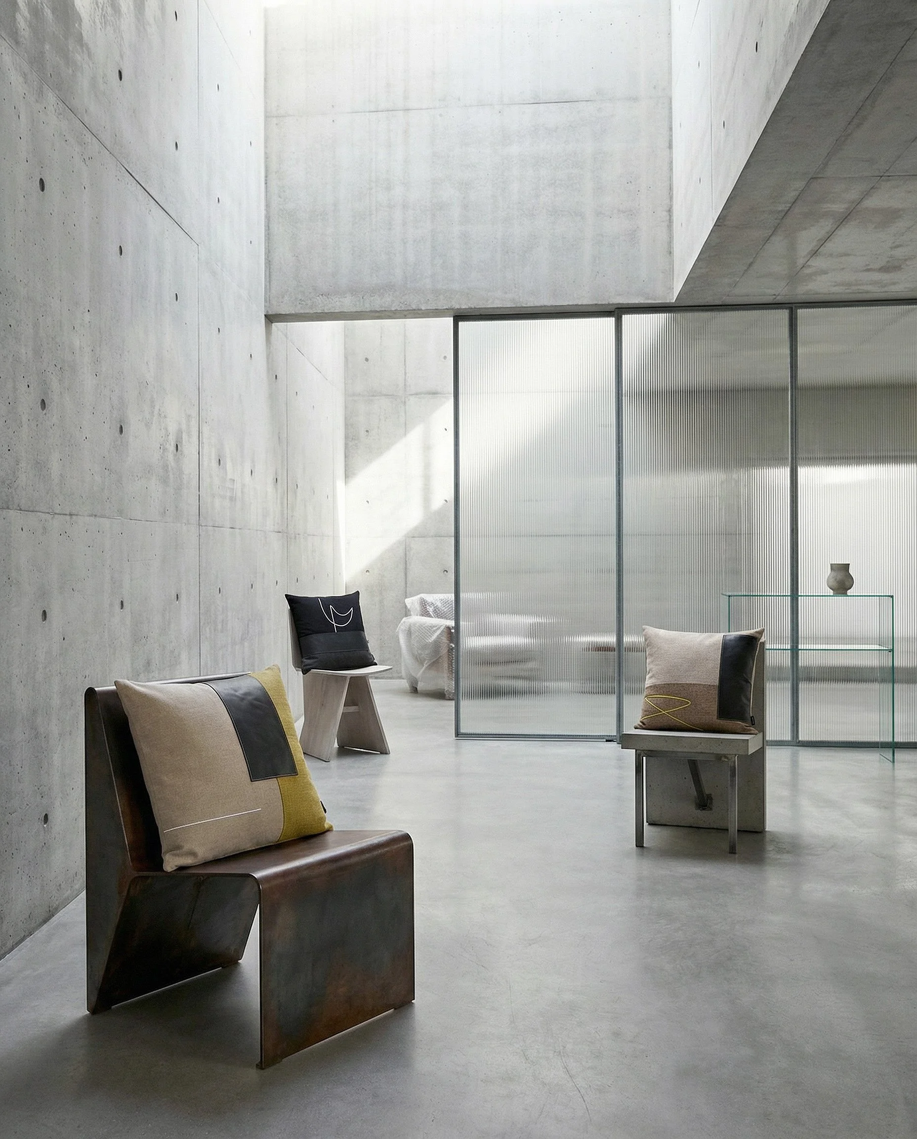 brutalist art gallery with product shots of ELAMA_02 RAIO_01 USKO_01 as different focal points on contemporary chairs.jpg
