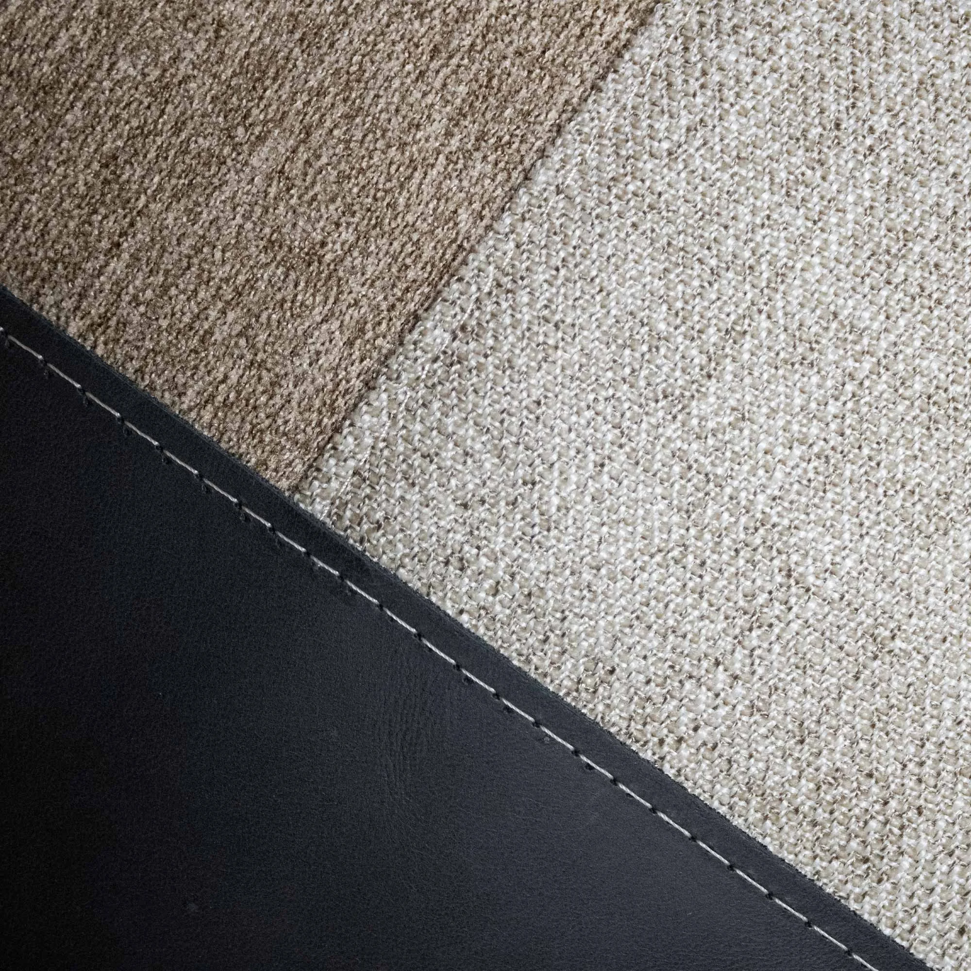 USKO_01 decorative cushion in beige and brown textile with black leather panel and abstract chartreuse embroidered detail