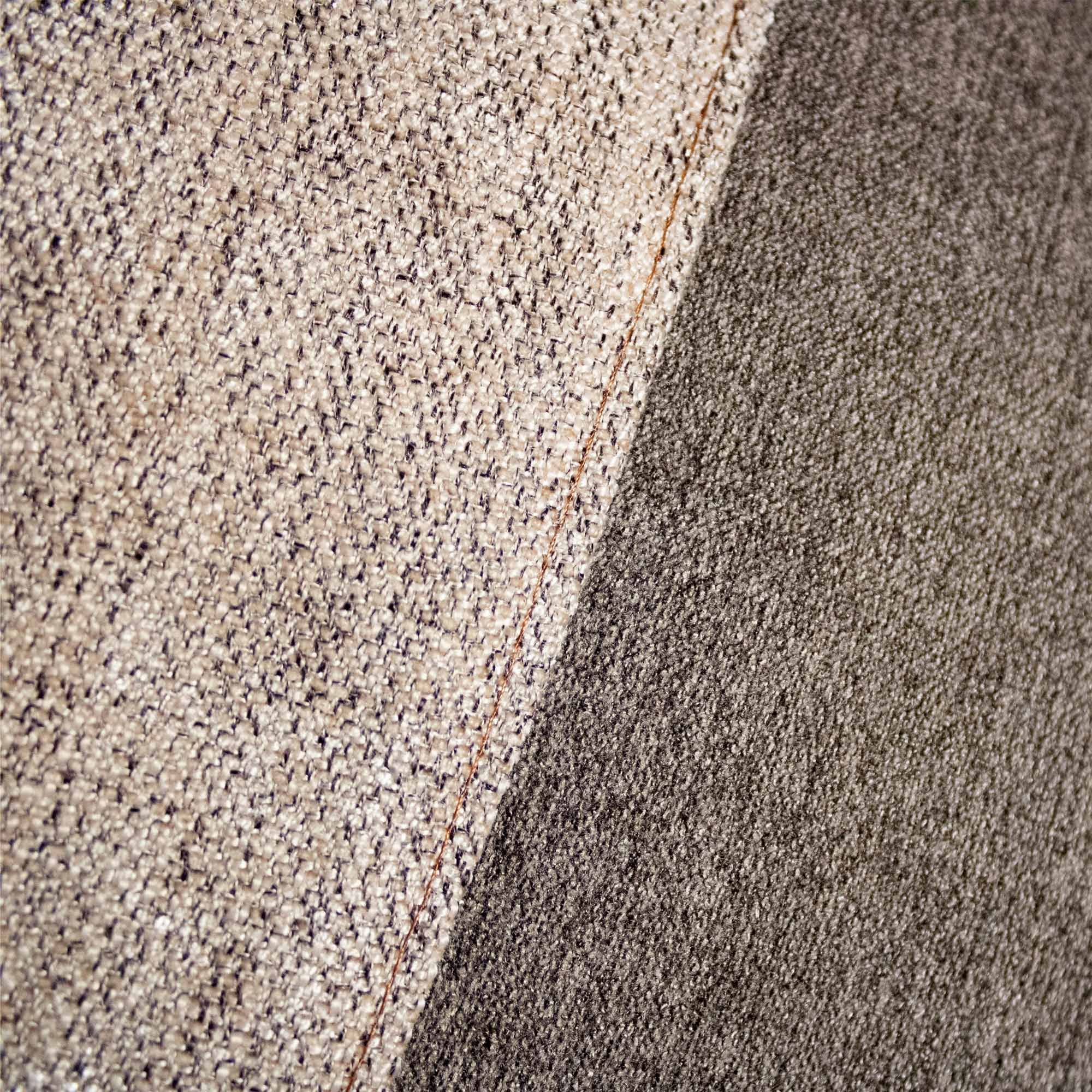 BASARI_02 cushion in tonal beige and brown textile with tan leather panel and white curved embroidery