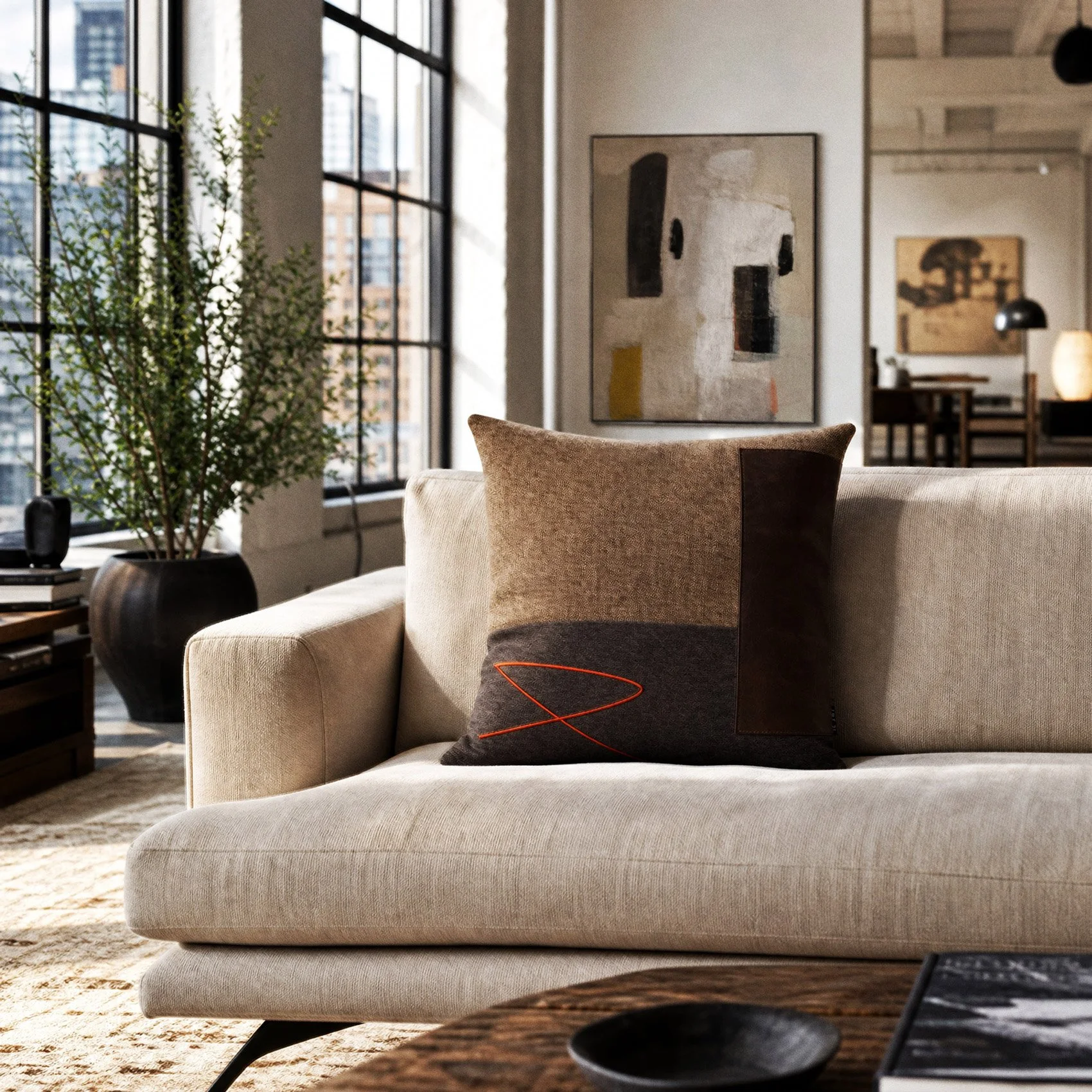 usko-01-embroidered-leather-cushion-couch-1.jpg