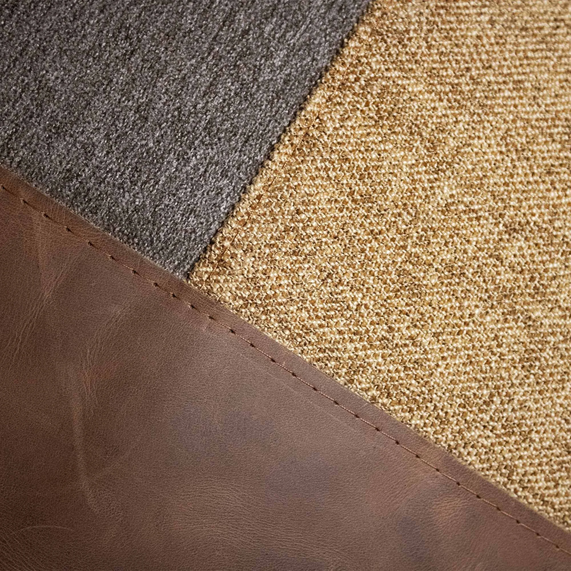 USKO_02 decorative cushion in brown and sepia textile with brown leather panel and abstract vermillion embroidered detail