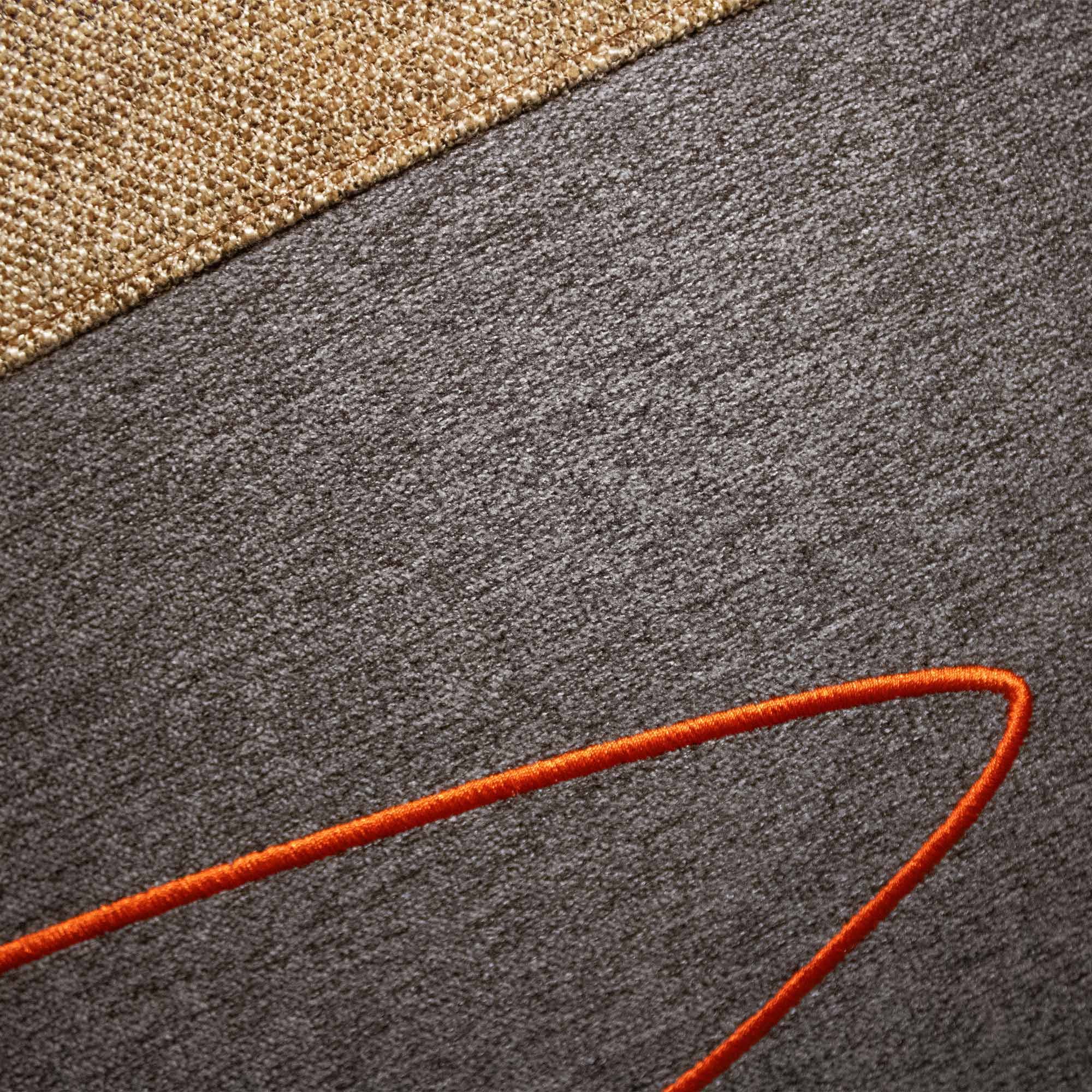 USKO_02 decorative cushion in brown and sepia textile with brown leather panel and abstract vermillion embroidered detail