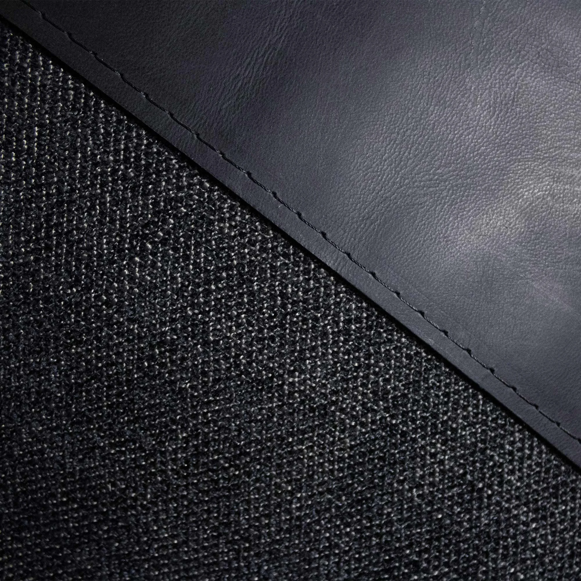 RAIO_01 decorative cushion in black textile with black leather panel and abstract light grey embroidered line detail