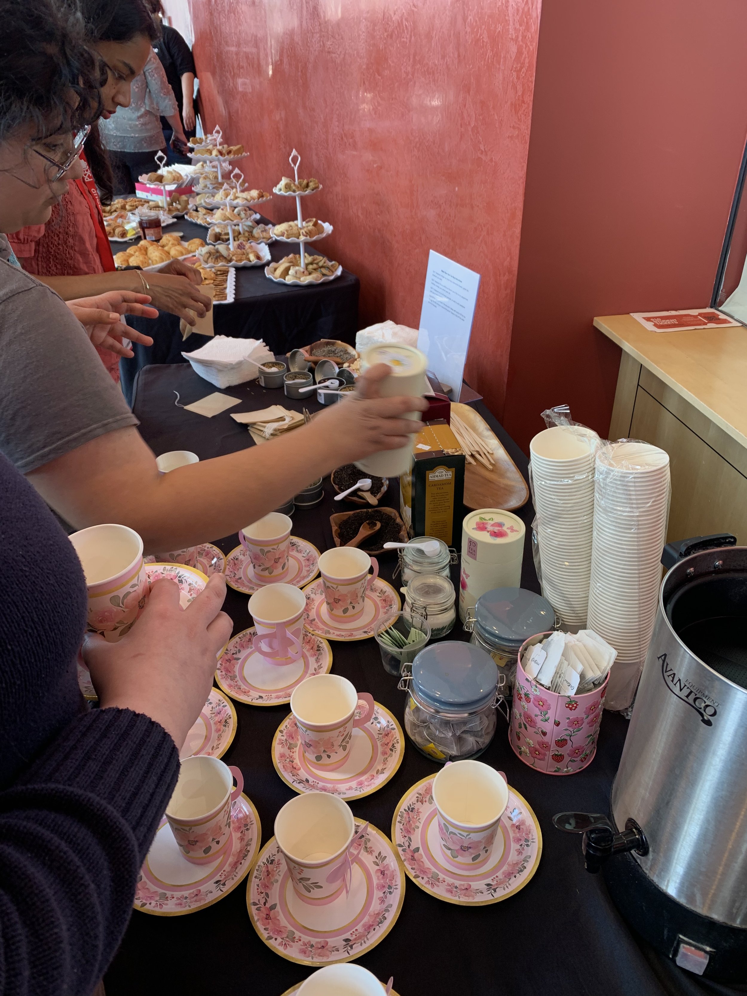 tea cups and tea on a table with students