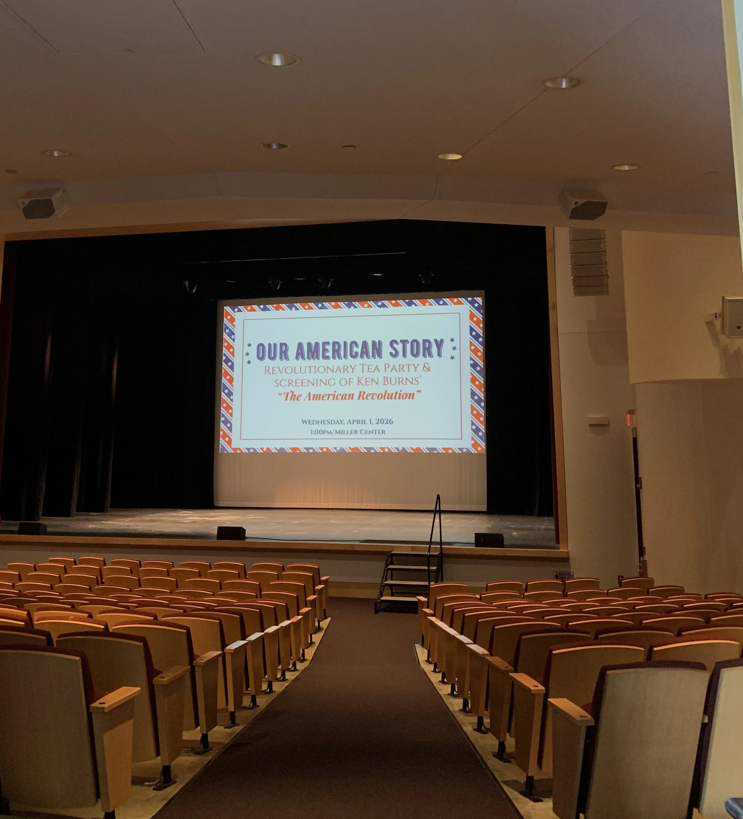 Our American Story poster on the screen in a theater