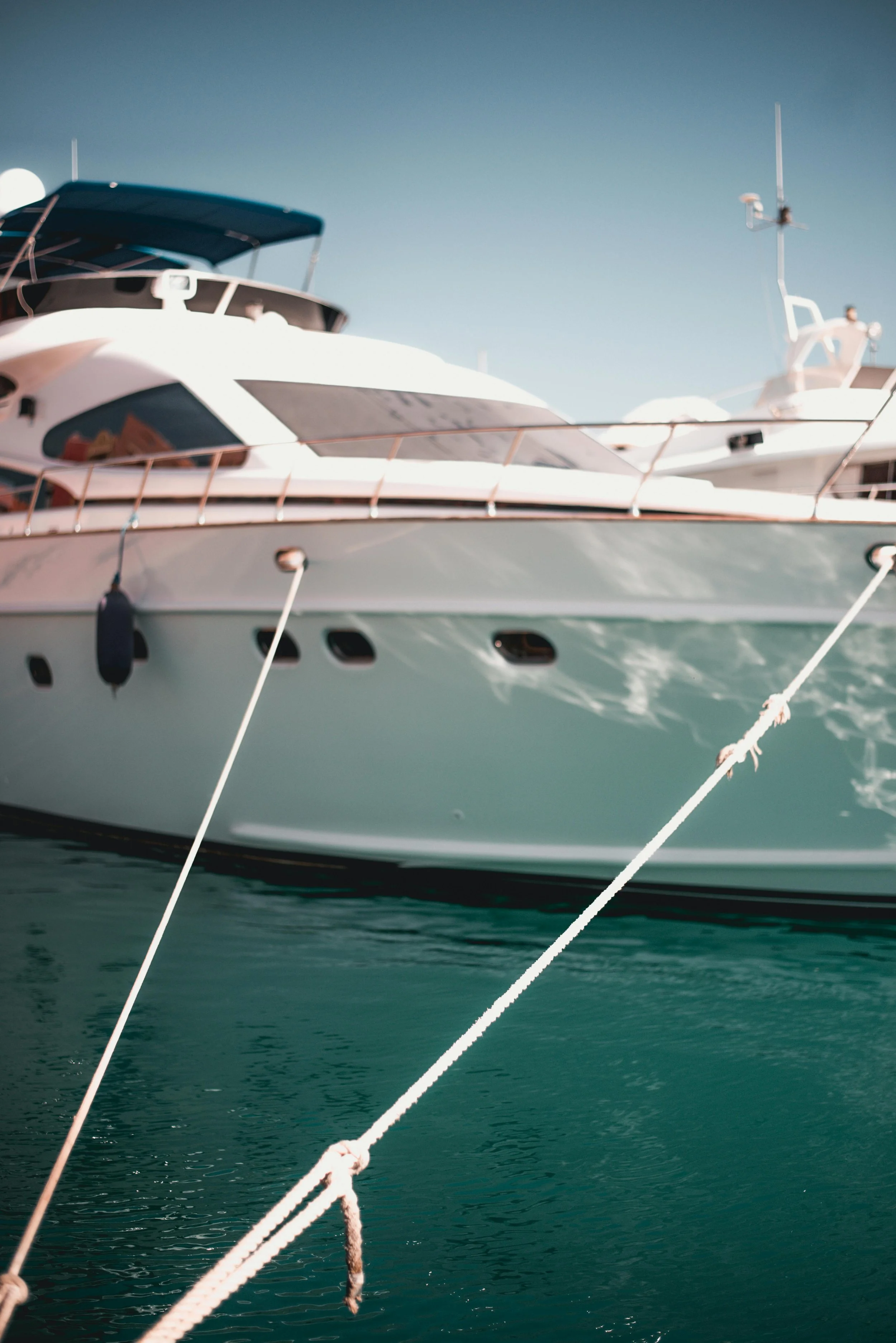 Lines set by deck crew extended from a Motor Yacht