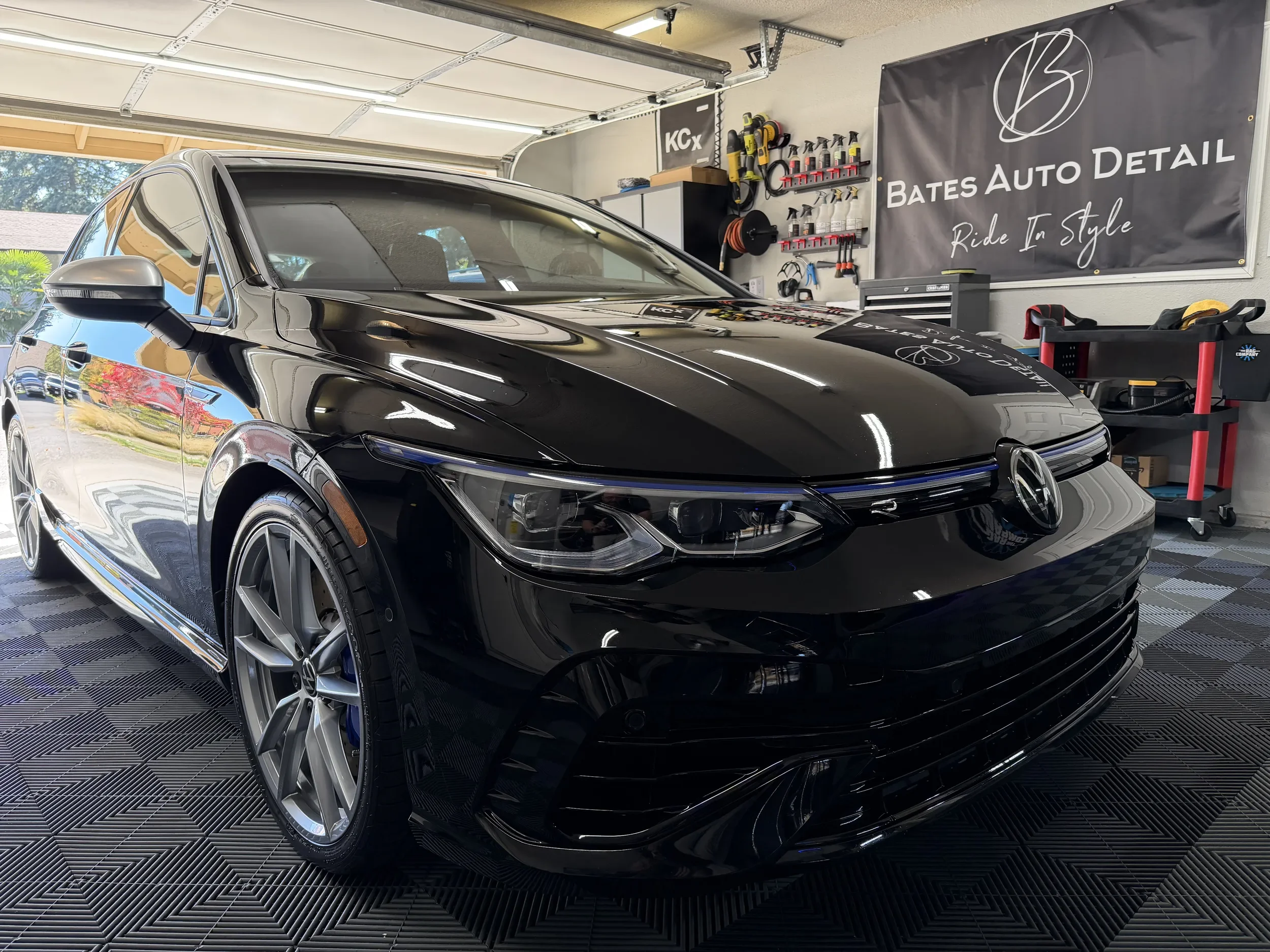 Front three-quarter view of a black Volkswagen Golf after detailing at Bates Auto Detail.