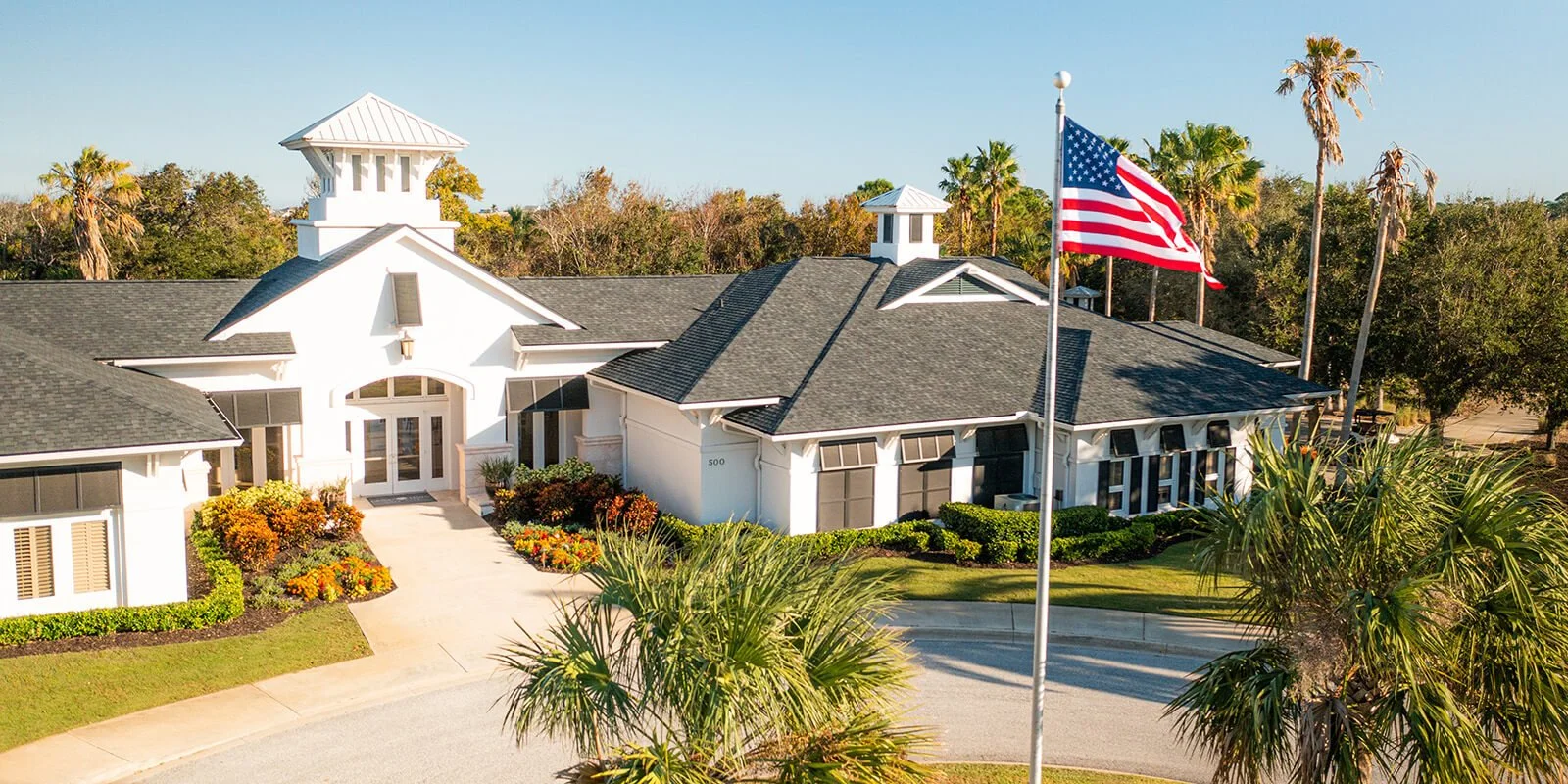 Grand Haven Palm Coast clubhouse and community center with landscaped grounds