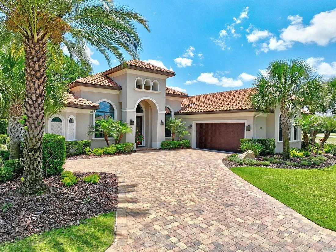 Luxury home in Hammock Beach Palm Coast Florida with landscaped driveway