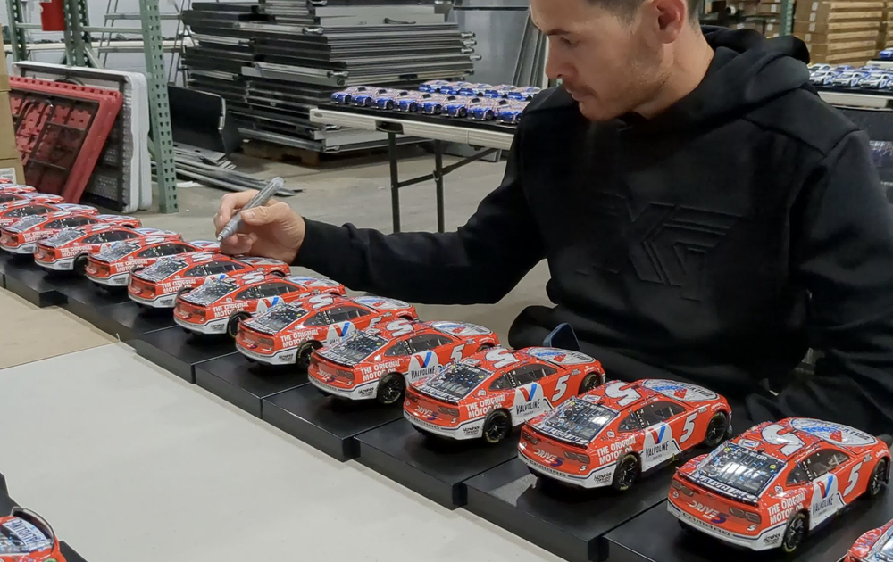 Kyle Larson Signing Diecasts.png