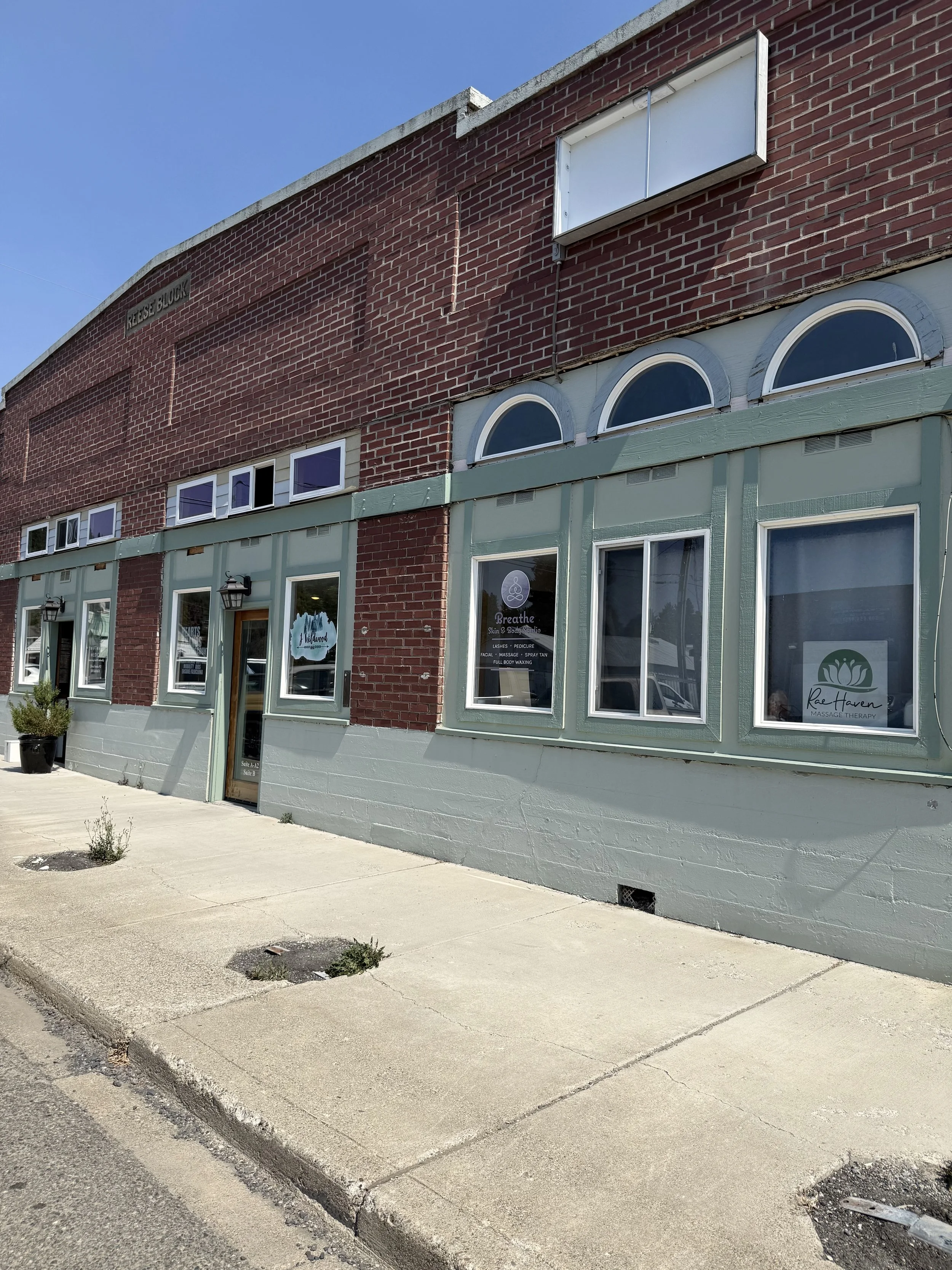 A photo of the outside of Rae Haven Massage Therapy studio in Cle Elum, Washington. The building is made form brick and is a part of the downtown Cle Elum area.