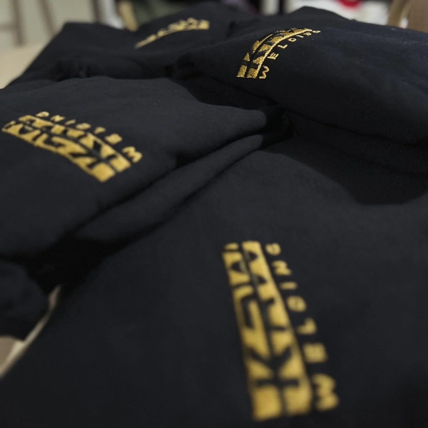 Black fabric with yellow embroidered text reading 'CULTURE' and '1973'.