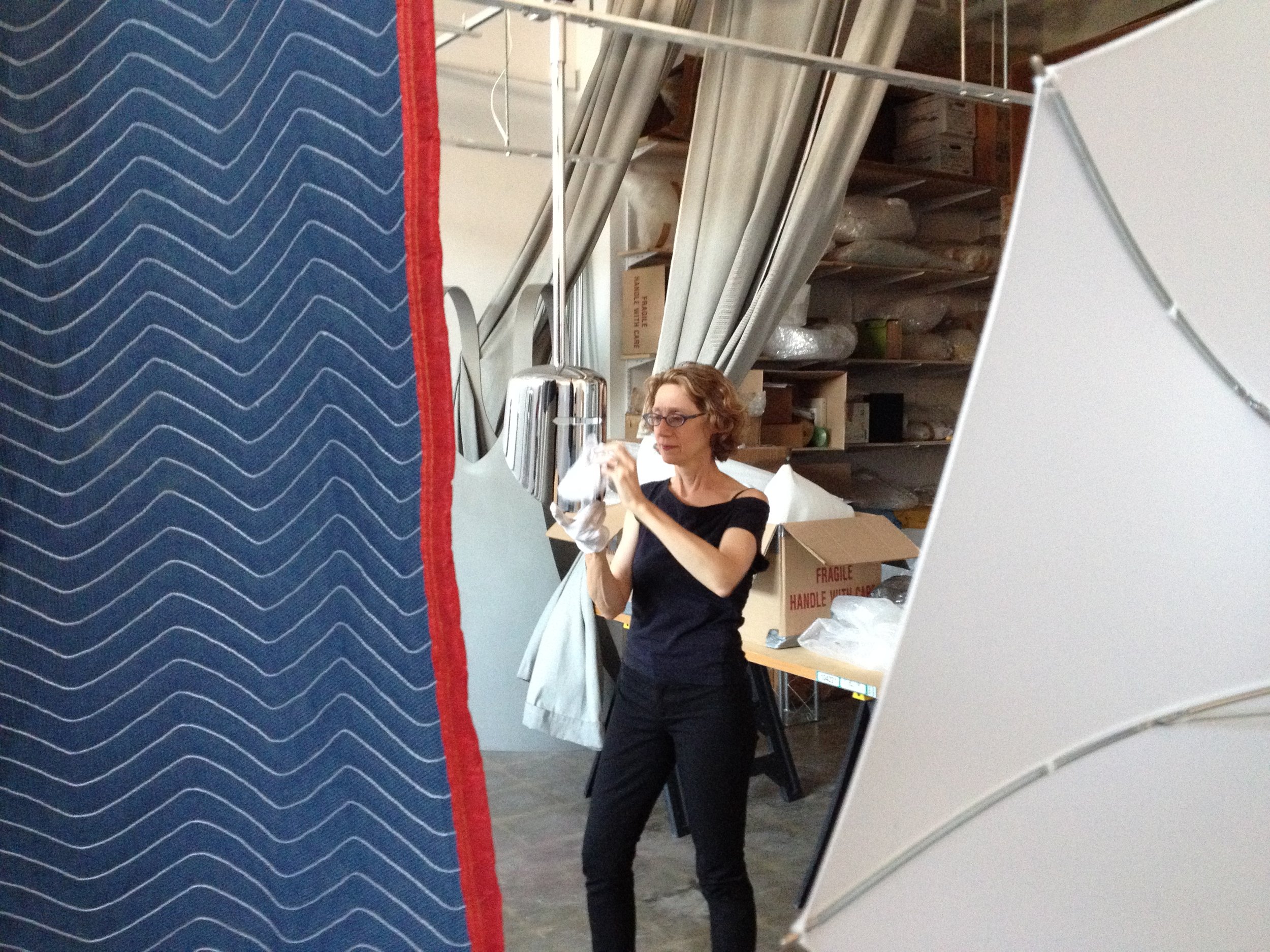 Photo of Michelle Jaffé working on Wappen Field in her studio