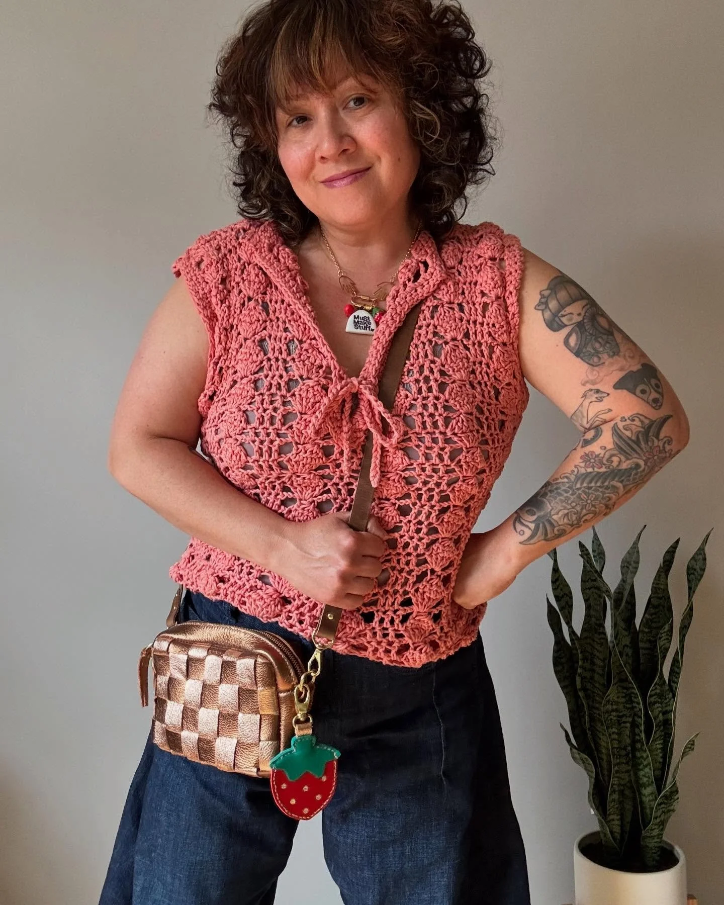 Happy Memade May! I highly recommend adding a strawberry charm when making your own bag. My hand stitched metallic leather crossbody bag is finally complete- Yay! The bag goes perfectly with my crochet blouse that I made last fall and never got aroun