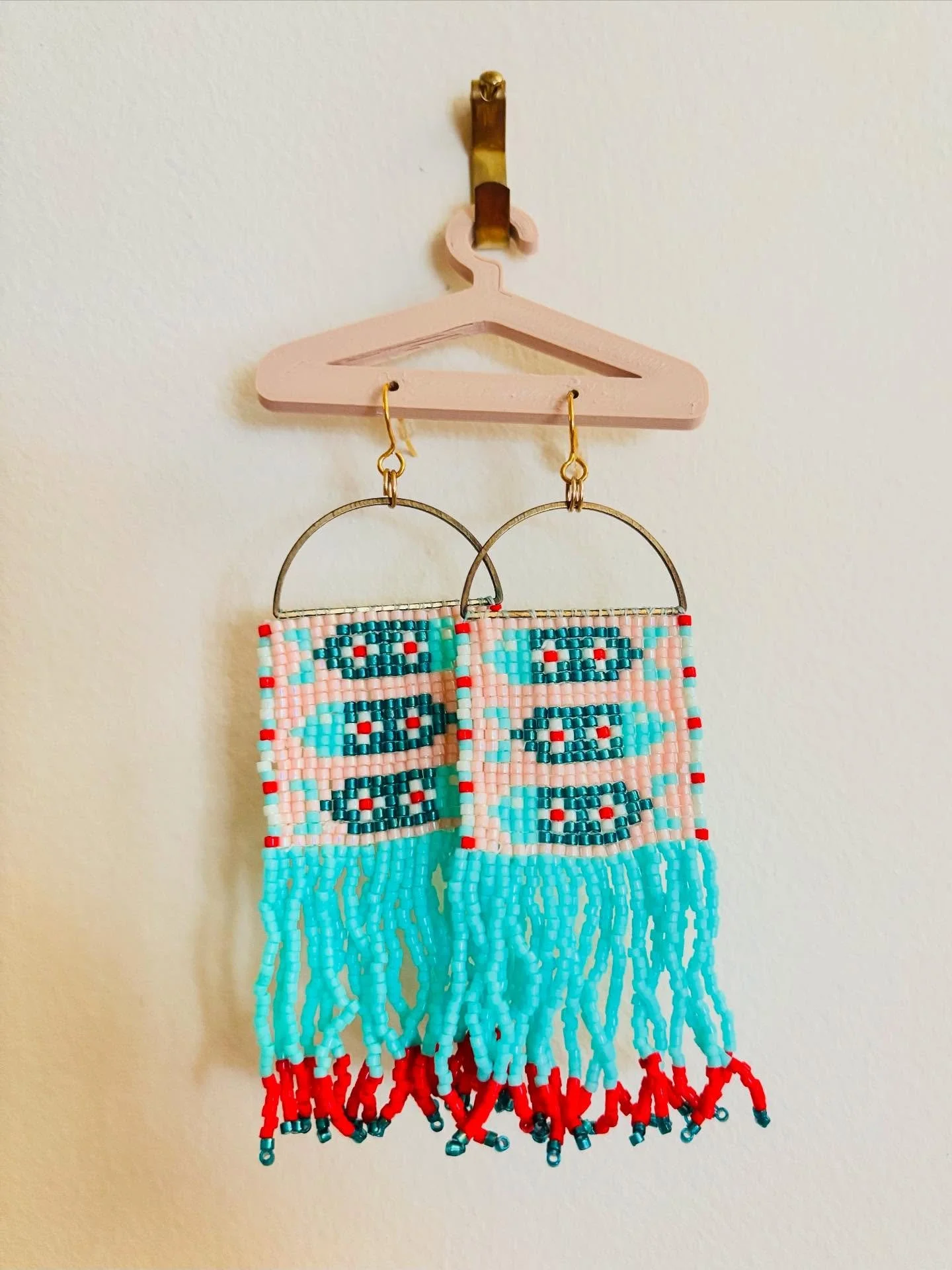 A new craft that I have added to my collection of hobbies is beading. I made these fun fish earrings for my trip to Colorado in June and I wear them frequently now. I used a beading layout website to plot of the pattern and then I used 11/0 Delica be