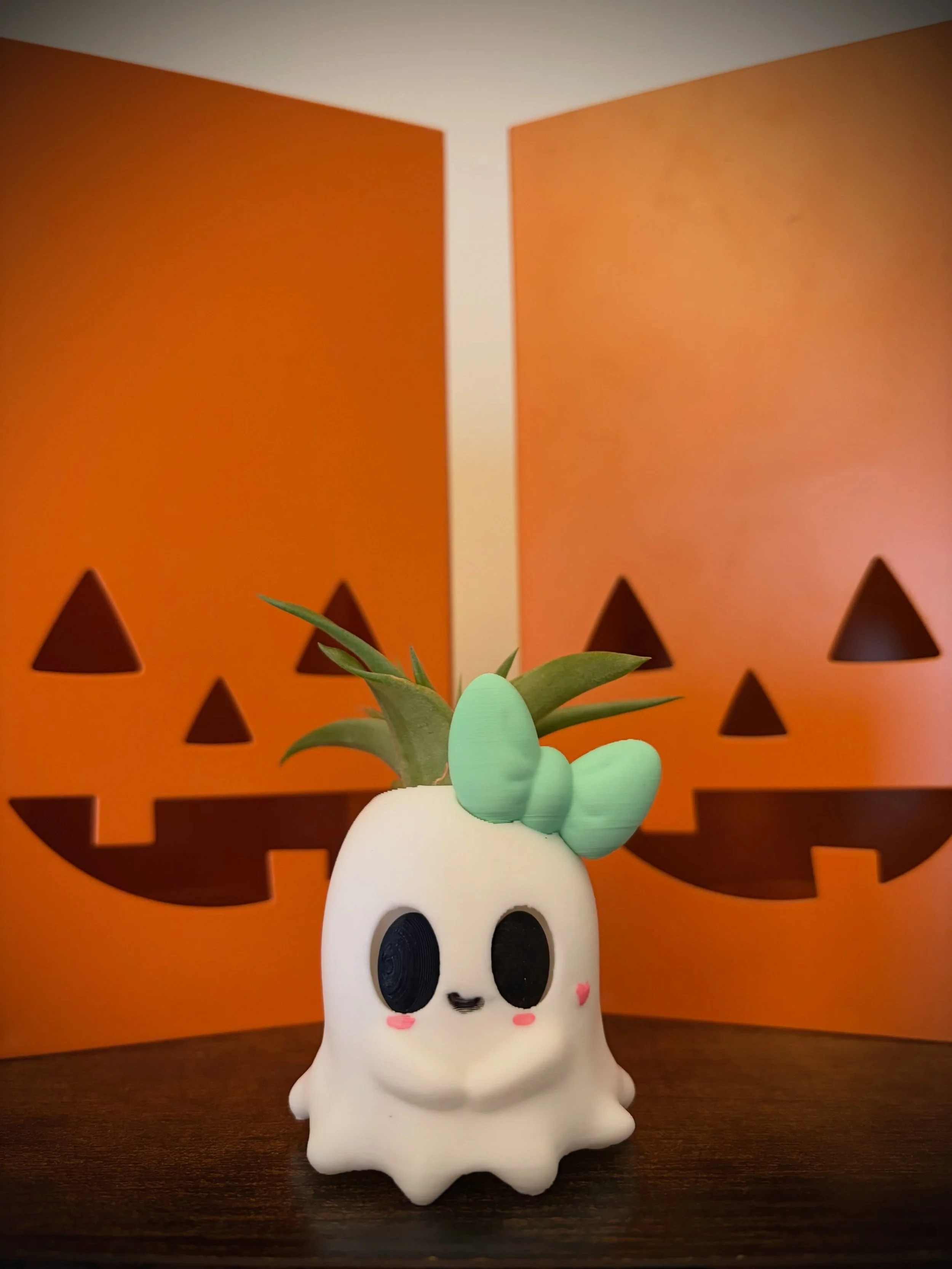 Day #25: Ghost - I am learning how to 3D sculpt so my second project was to make another Halloween cutie character that could display my many baby air plants! The Ghost is the second one I sketched, 3d sculpted and printed out. I also added a girly b