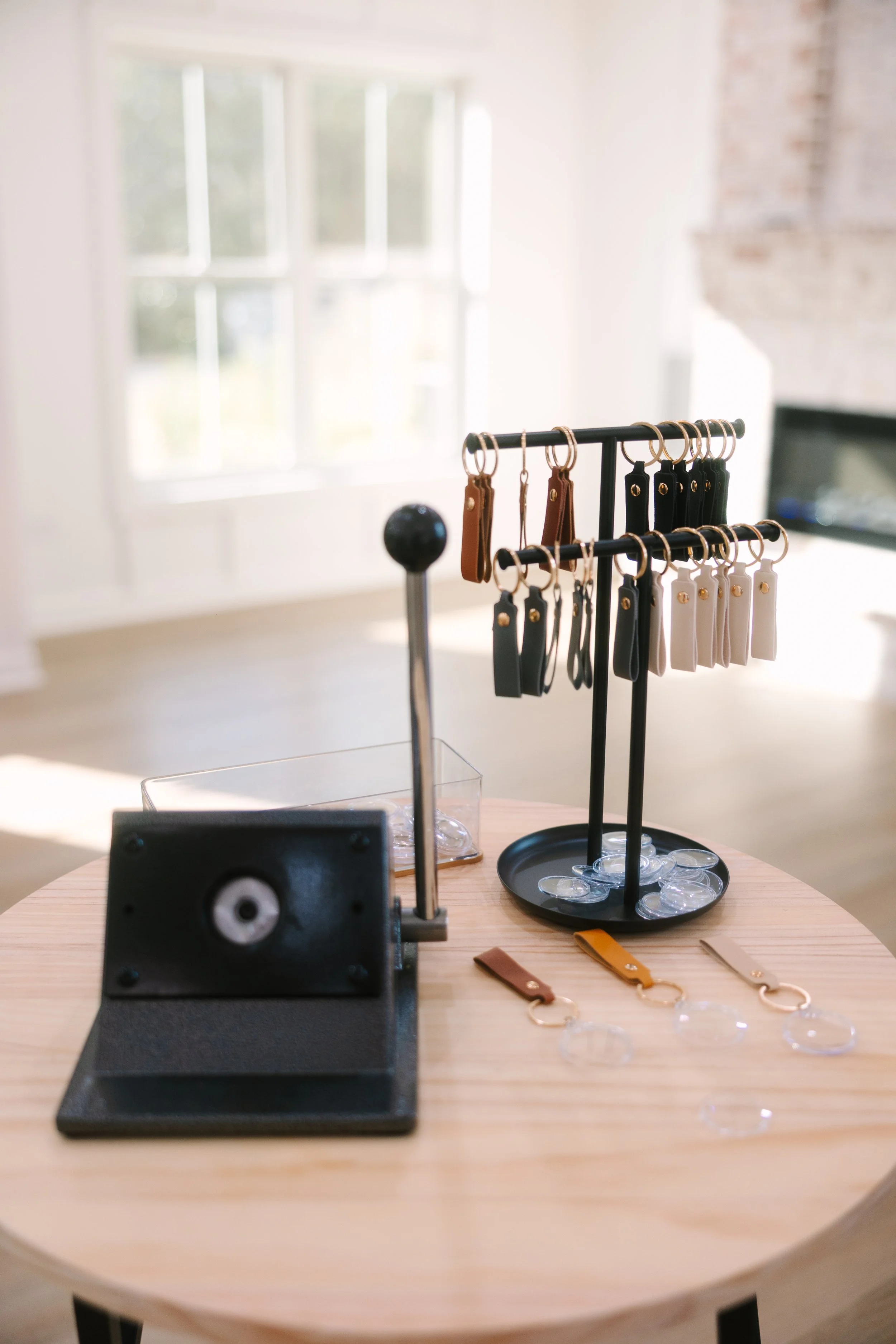 Elevate your photo booth rental with a keychain station.  Our on-site photo booth concierge will assist guests in creating a keychain keepsake with their photo booth prints.