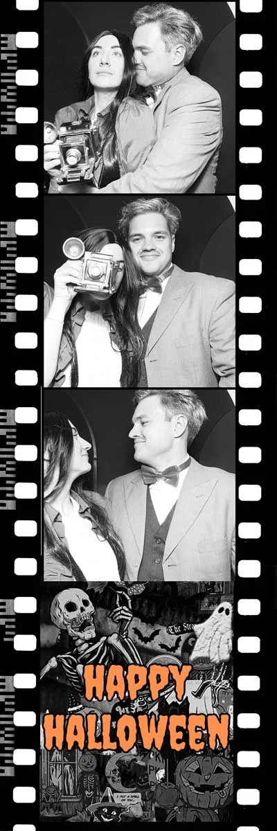 A Halloween photo booth adorned with spooky decorations, inviting guests to snap fun, festive pictures. Vintage film style photo strips and black and white pictures for a retro Halloween vibe