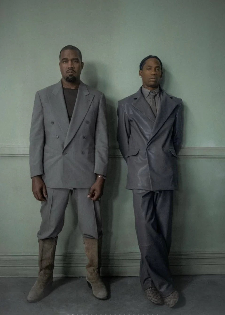 Ye and Travis Scott standing together behind the scenes on the set of the music video "Father," directed by Bianca Censori for Ye's album Bully, March 2026.