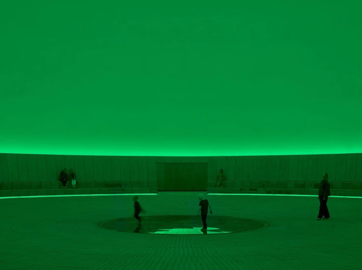Visitors inside James Turrell As Seen Below The Dome, green light installation, ARoS Aarhus Art Museum, Denmark 2026