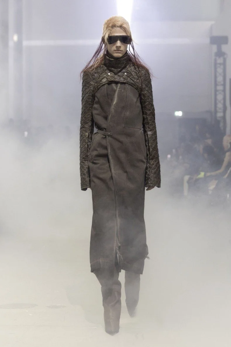 Rick Owens AW26 TOWER runway show at Palais de Tokyo in Paris with model in black leather armor walking through heavy fog