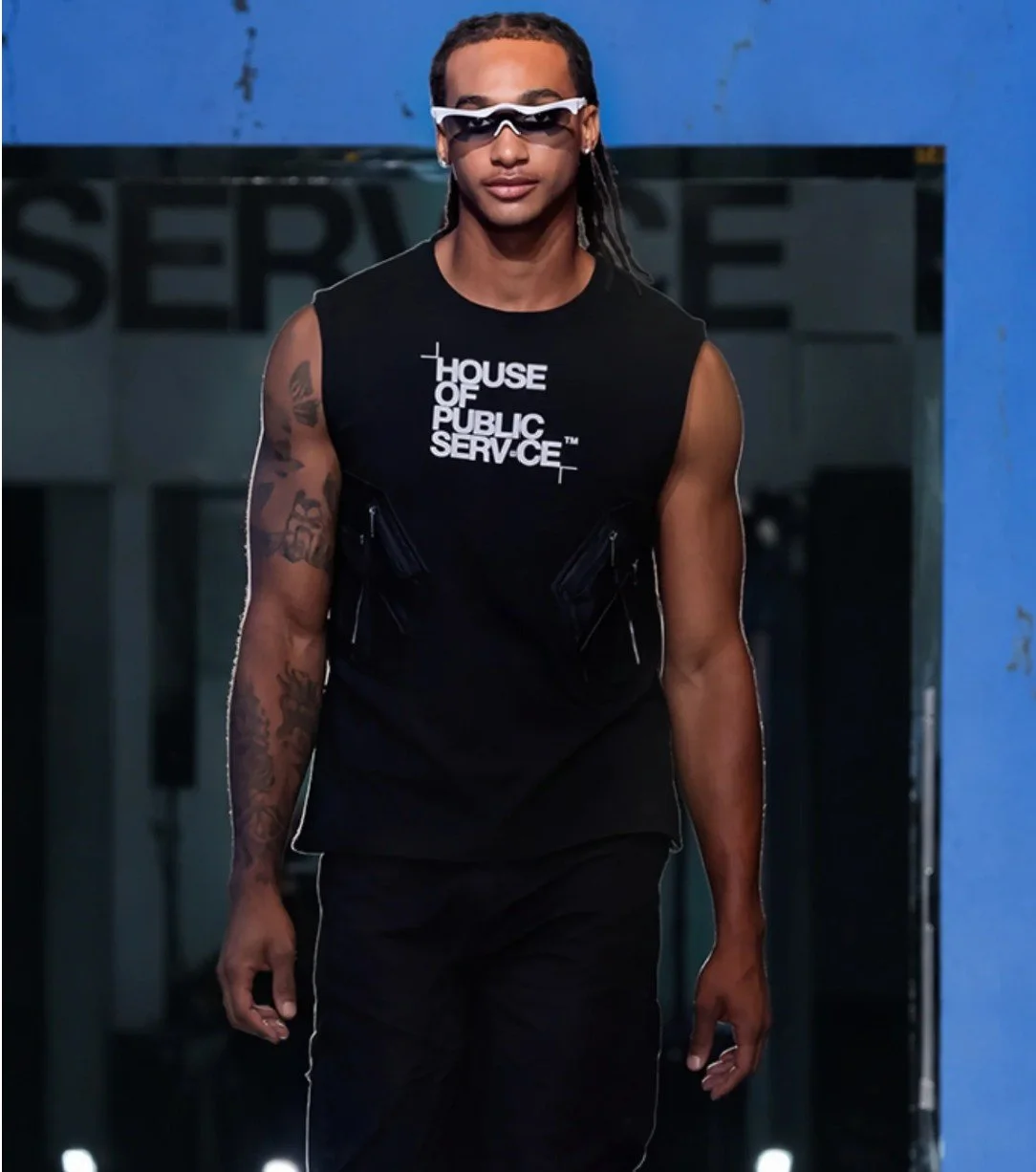 Model on the runway in Raphael Young's The Rest Is Noise SS27 collection for House of Public Serv-ce at New York Fashion Week glowing shades and tank top