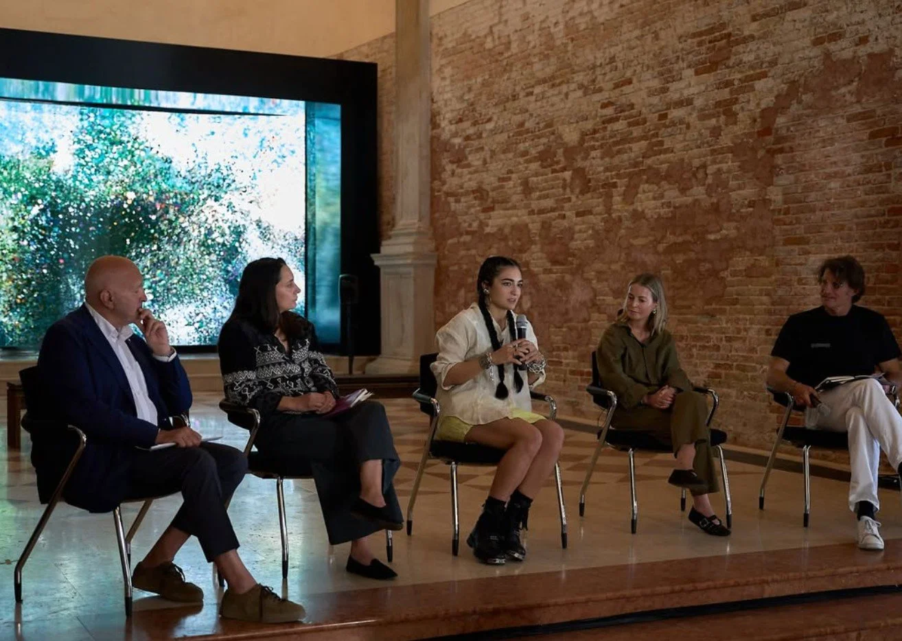 Elnara Nasirli speaking at As Above So below talk, during La Biennale di Venezia 2026, Ex Church Santi Cosma e Damiano