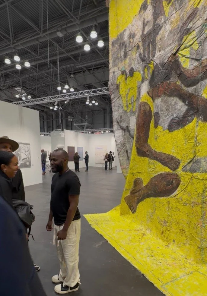Kaloki Nyamai in front of his work at Armory 2026
