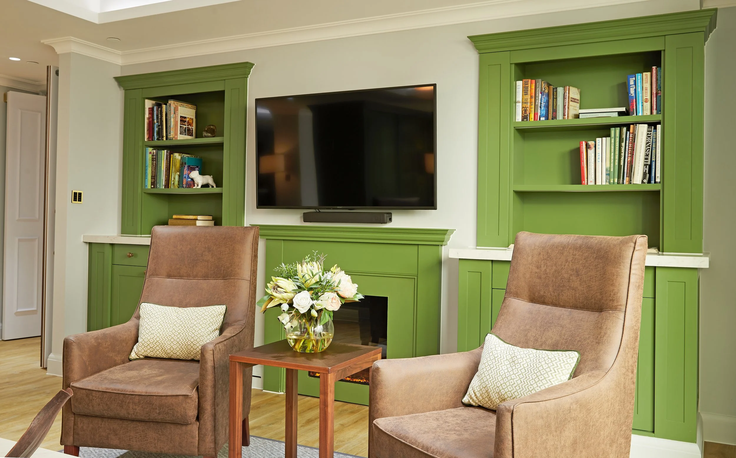 Care home living room with bespoke cabinetry and comfortable seating designed by StyleSmith Interiors in Harrogate, serving Leeds, York and Yorkshire