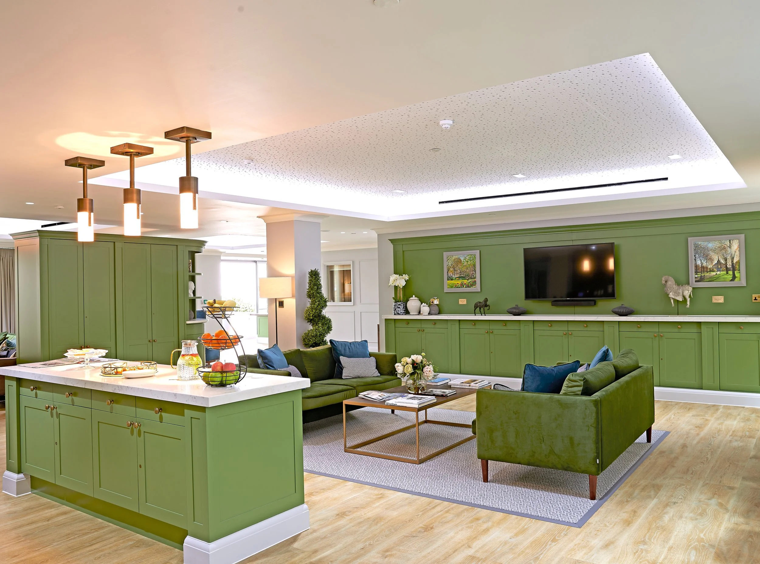 Modern communal living space designed by StyleSmith Interiors featuring bespoke joinery, comfortable seating and a welcoming environment for care home residents