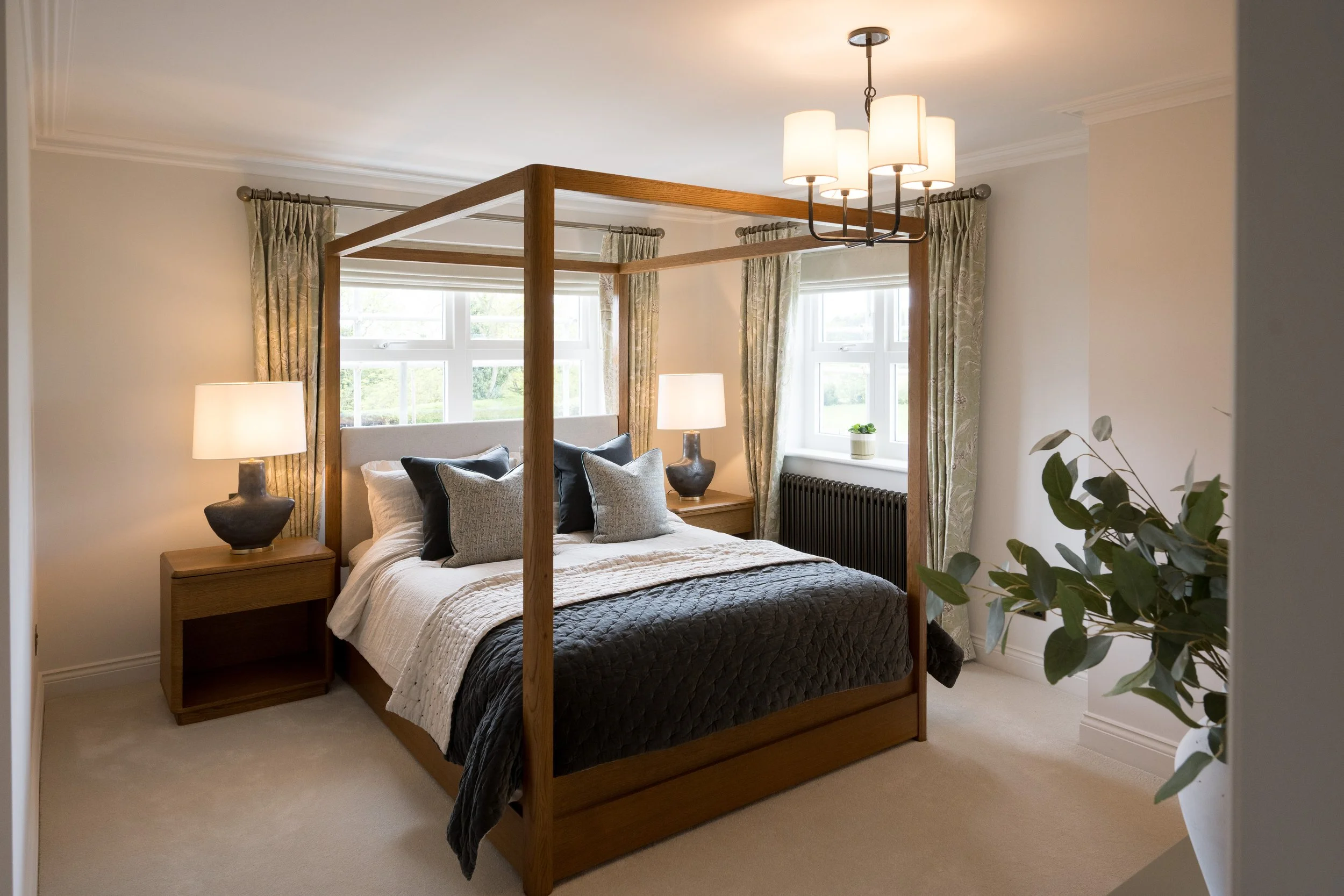 Bedroom, bathroom and bespoke cabinetry design by StyleSmith Interiors, featuring a contemporary four-poster bed, bespoke joinery, contemporary lighting and a calming neutral colour palette