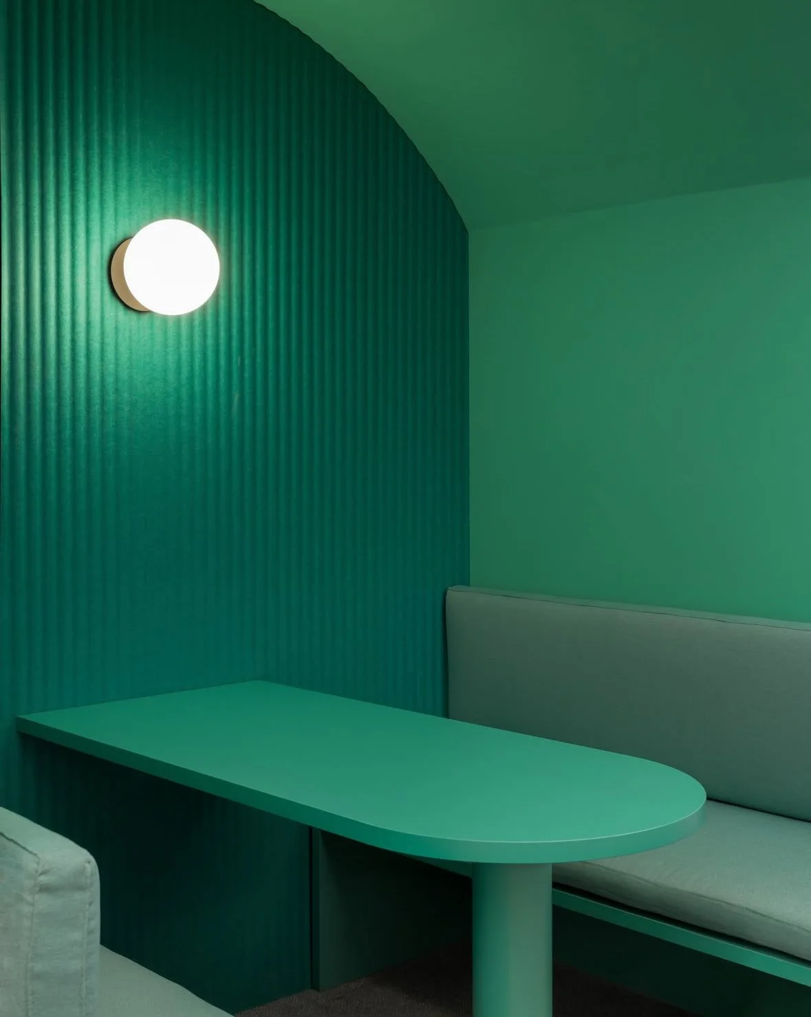 Interior of a room with a wallcovering and Millerighe acoustic panel, brings rhythm and quiet texture to the wall. Its vertical linear pattern