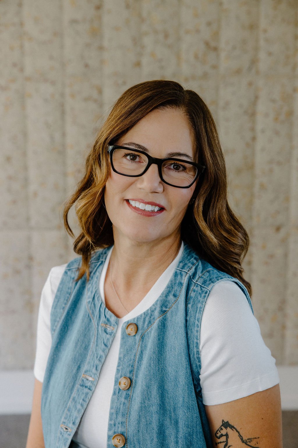 Brenda Alford, in charge of operations and business development for Leuk Finishes, the US distributor of Slalom Acoustics, background velvet jazz Slalom panel