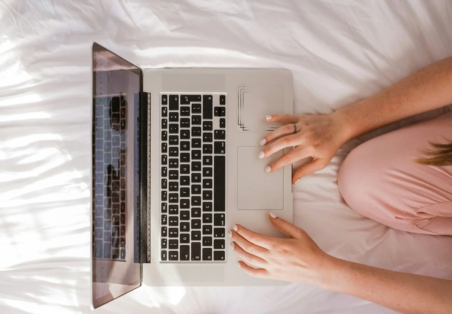 Woman viewing squarespace website on macbook laptop
