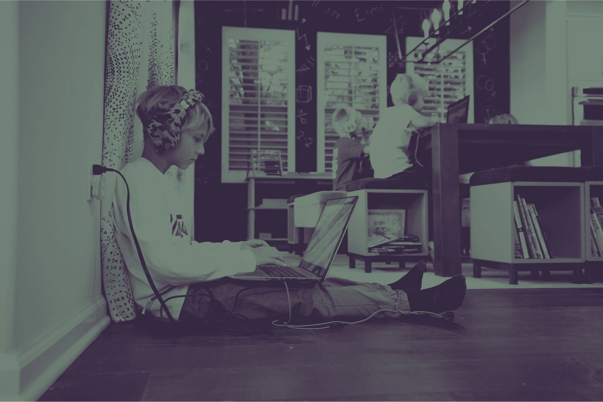 Caleb doing laptop work - minty.jpg