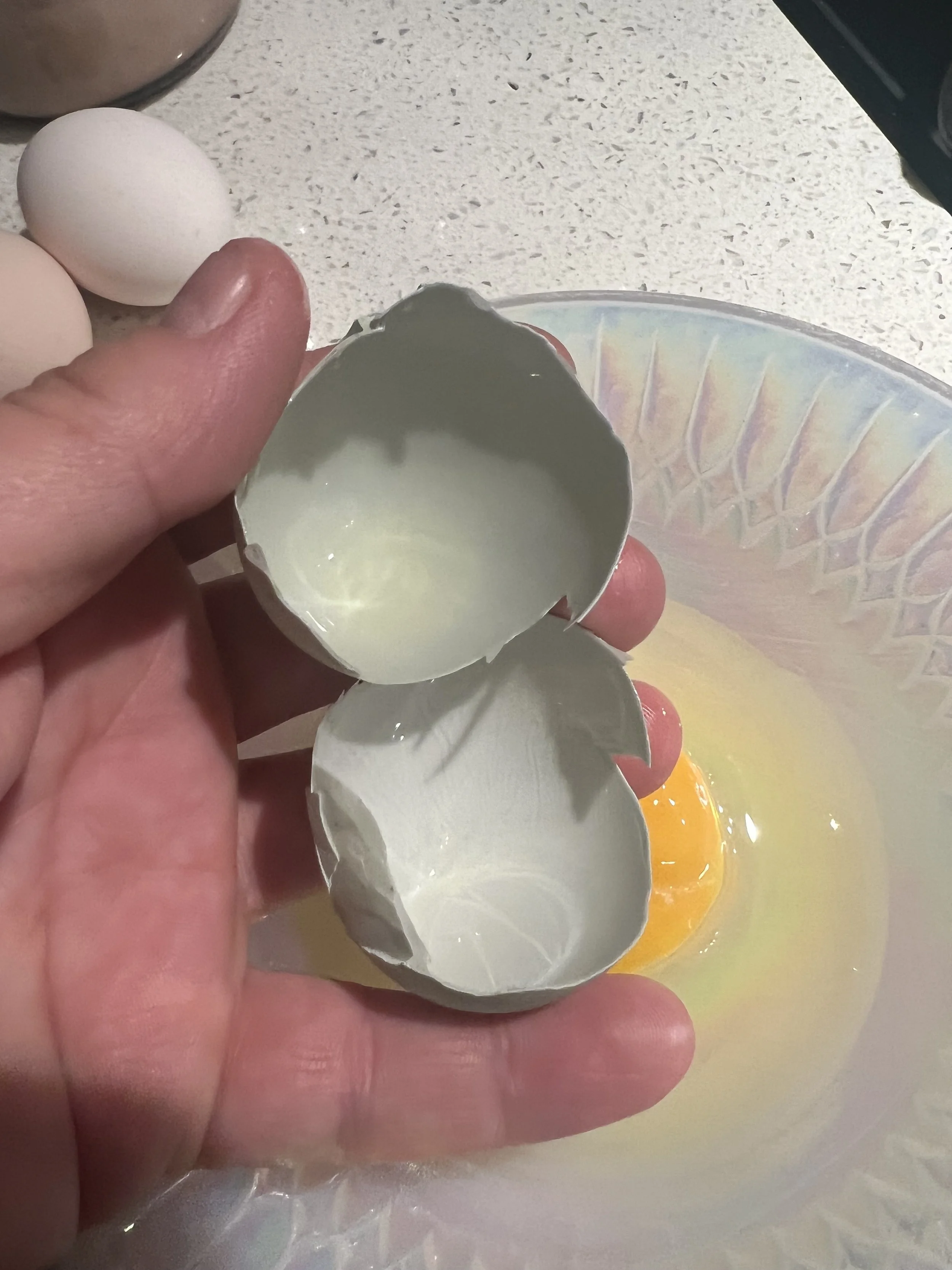 Photo of blue egg cracked open