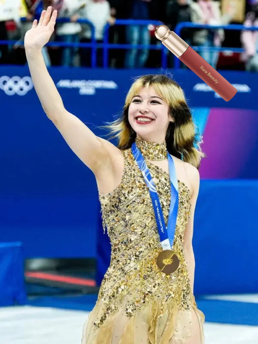 Alysa Liu waving after winning her gold medal after the Olympics. An image of the Rare Beauty Soft Pinch Lip Oil in shade "Delight" was added next to Alysa.
