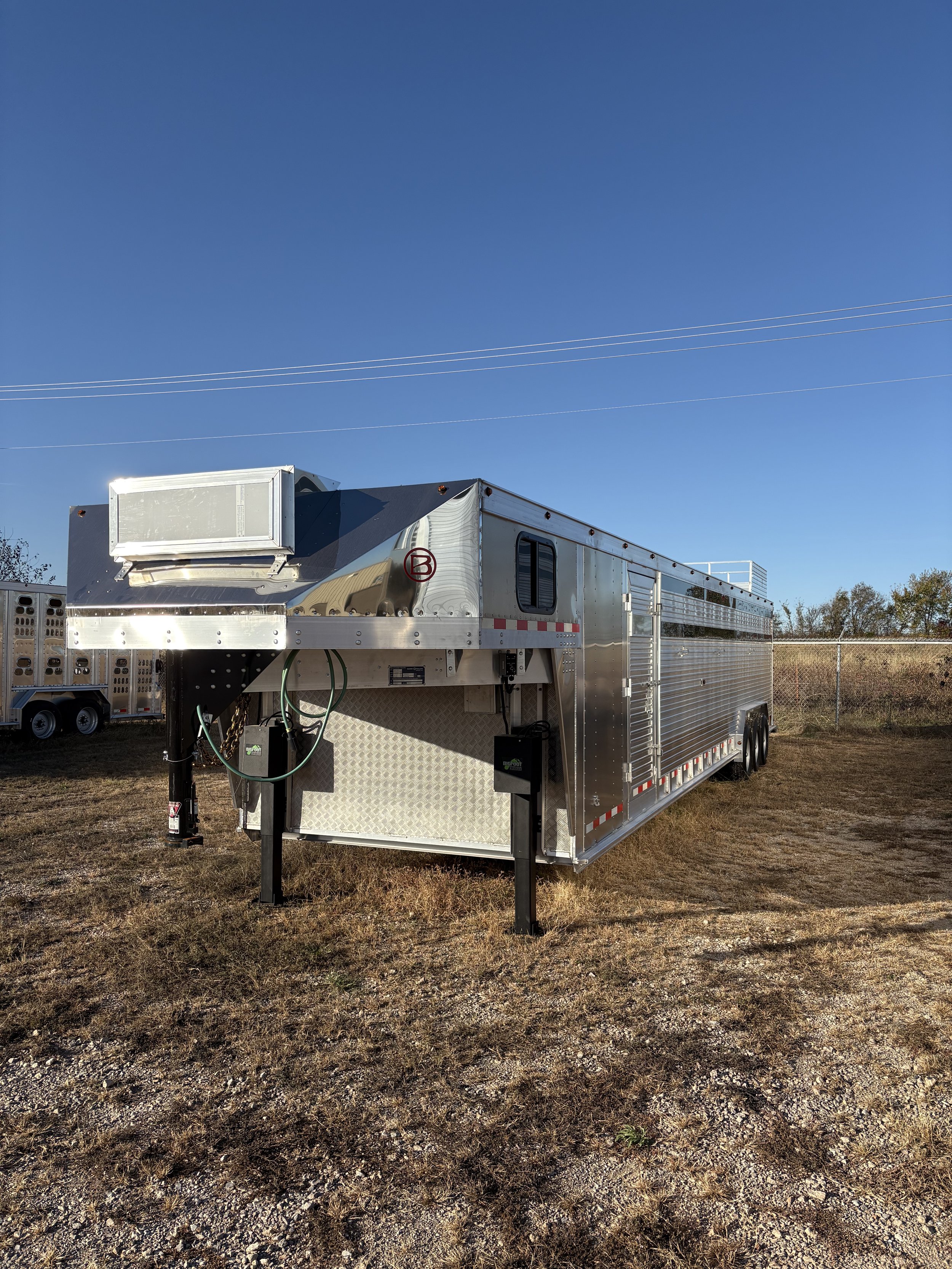 Gooseneck cattle trailer hitch and storage compartment on a Barrett trailer