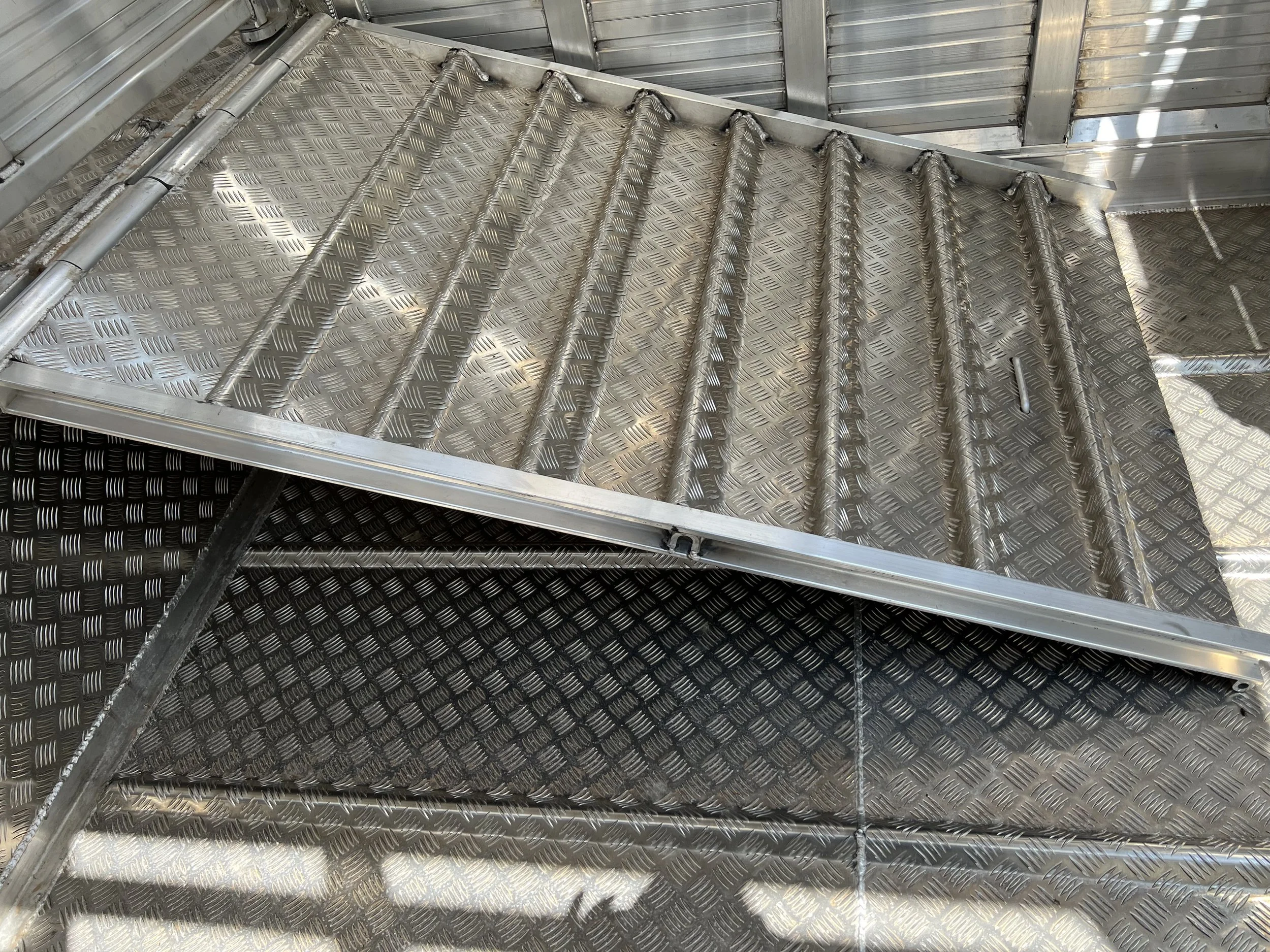 Barrett Trailers groundload livestock trailer with fold-down ramps, trusted by Midwest cattle ranchers
