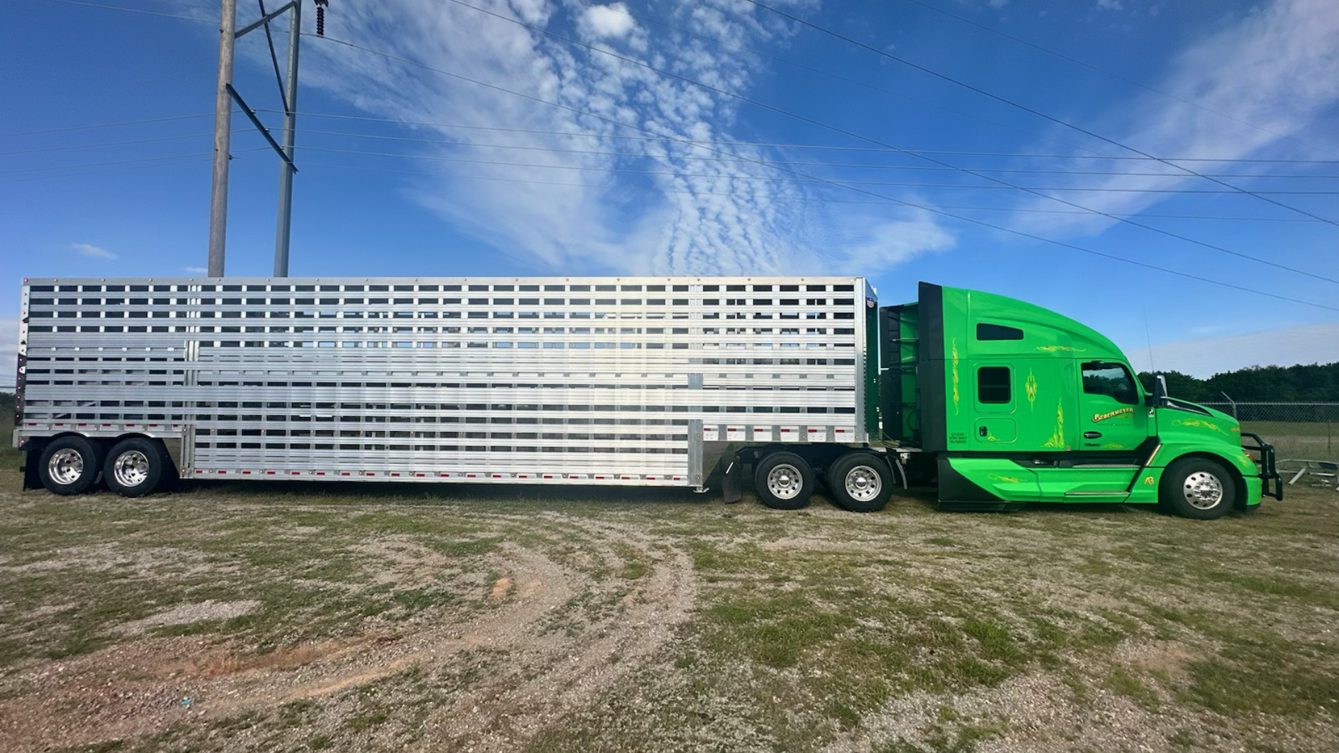Barrett Trailers semi livestock trailer hauling cattle through rural Oklahoma