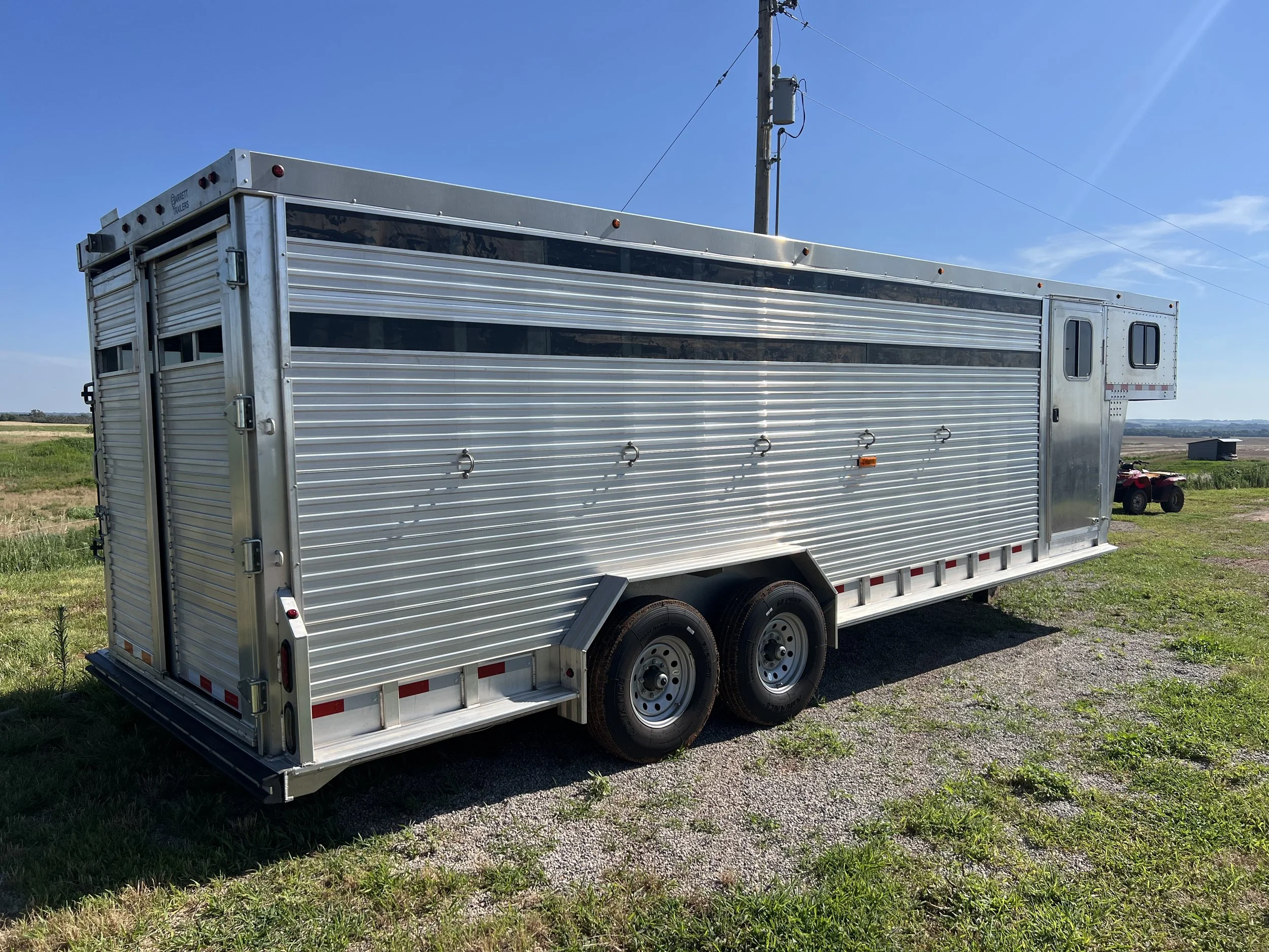 View of a Barrett gooseneck cattle trailer with custom livestock configuration